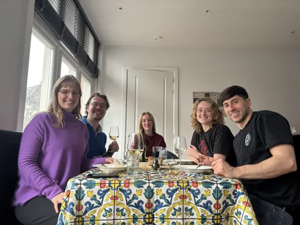 Friends laughing together at dinner